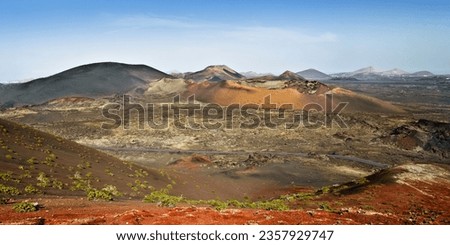 Timanfaya national park landscape of volcano craters on Lanzarote, Canary islands, Spain. Panoramic view or the popular touristic attraction.