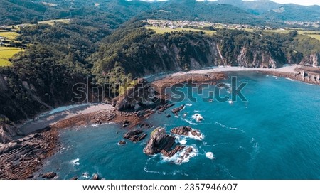 Exploring Natural Wonder: The Formidable Cliffs of Playa del Silencio or Gaviero, Defying the Deep Blue Sea in an Aerial Photograph Captured with a Drone Royalty-Free Stock Photo #2357946607