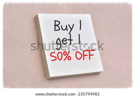 Text buy 1 get 1 50% off on the short note texture background