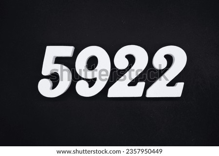 Black for the background. The number 5922 is made of white painted wood.