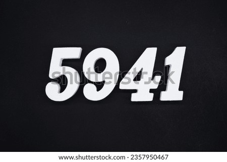 Black for the background. The number 5941 is made of white painted wood.