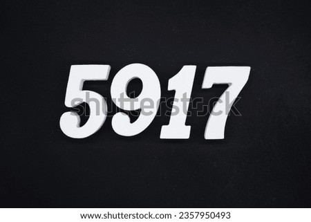 Black for the background. The number 5917 is made of white painted wood.