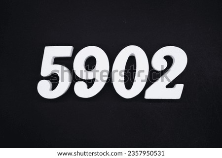 Black for the background. The number 5902 is made of white painted wood.