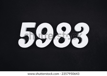 Black for the background. The number 5983 is made of white painted wood.