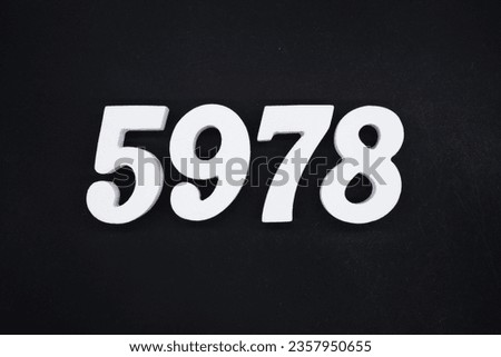 Black for the background. The number 5978 is made of white painted wood.