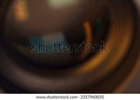 Close up on a photographic front glass with blurred colors.