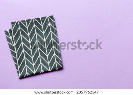 top view with blue kitchen napkin isolated on table background. Folded cloth for mockup with copy space, Flat lay. Minimal style. Royalty-Free Stock Photo #2357962347