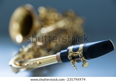 Saxophone on the gray background