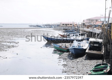 When the sea water recedes, fishing boats cannot go to sea