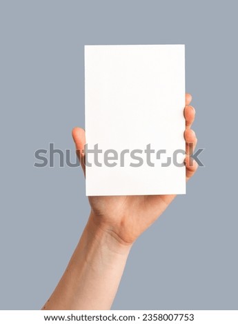 Hand holding holiday post card mock up, blank empty mockup. Royalty-Free Stock Photo #2358007753