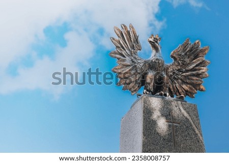crowned eagle on a concrete pedestal 