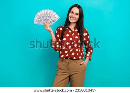 Photo of elegant nice successful person put hand pocket hold hundred dollar bills isolated on teal color background