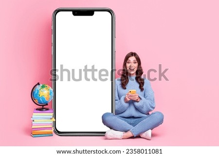 Full body photo of excited lady use telephone pile stack book planet earth glove empty space banner isolated on pink color background