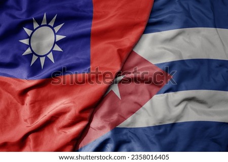 big waving national colorful flag of taiwan and national flag of cuba . macro