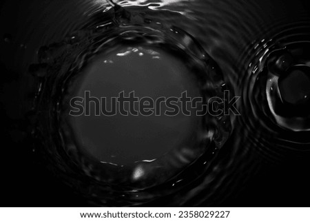 The black crown of water droplets splashing on the skin has an abstraction. Refreshing and giving a feeling of fighting, fresh, shiny, natural.