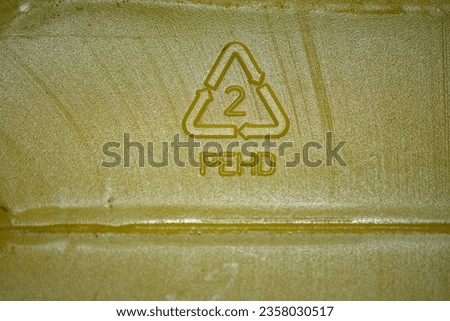 PEHD Plastic symbol on yellow food storage container.