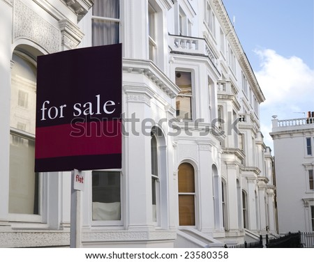 Luxury townhouses with "for sale" sign and copy space.  at Kensington area(London).