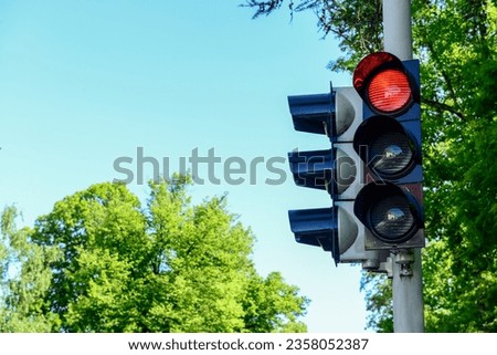 View of red traffic light in city, closeup