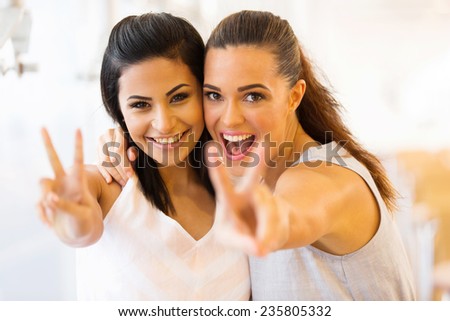 cheerful two young friends having fun Royalty-Free Stock Photo #235805332