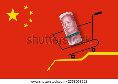 Shopping basket with yuan money on yellow arrow. Economic crisis, inflation and commodity prices concept Royalty-Free Stock Photo #2358058329