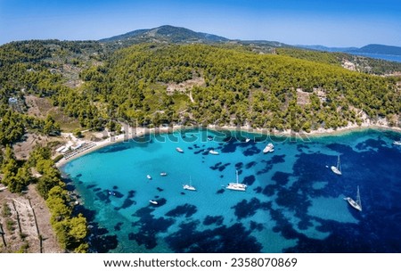 Aerial view of the beautiful beach of Milia, Alonissos island, Sporades, Greece, with turquoise sea and thick pine tree forest Royalty-Free Stock Photo #2358070869