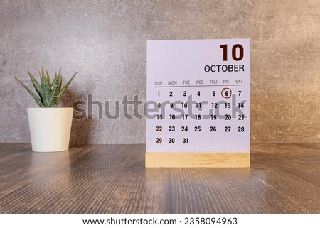 06 October text with blackboard background for calendar. And October is the tenth month of the year.