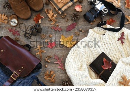 Autumn travel outing hiking flat lay - accessories for leaf peeping, going on a hike, bird watching Royalty-Free Stock Photo #2358099359