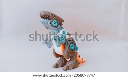 White dinasaurus t-rex toys and brown heads