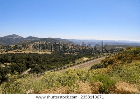 View of the Palomar Mountain State Park mountain ridge from S Grade Rd, Pauma Valley in Southern California.