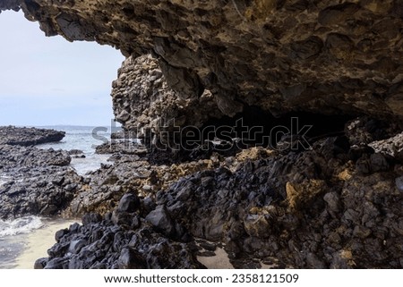 rocky caves on the beach of little vomo island fiji