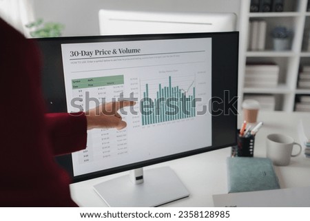 Two people looking at datasheets of marketing and sales results, analysis of business results jointly between executives, department heads and employees to brainstorm company sales management. Royalty-Free Stock Photo #2358128985