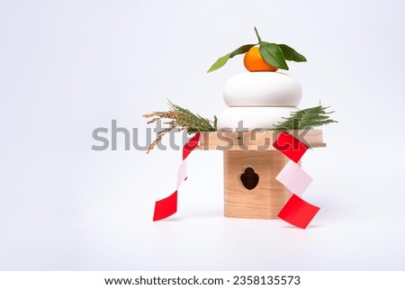 "KAGAMIMOCHI" is placed on the right side and photographed against a white background. Royalty-Free Stock Photo #2358135573