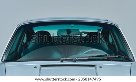 Glass windshield on a silver car Royalty-Free Stock Photo #2358147495