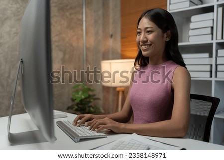 Asian businesswoman sitting working with desktop pc for finance, documents, accounting, tax, reports, marketing, growth statistics, business analytical research concept.