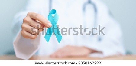 Blue November Prostate Cancer Awareness month, Doctor with Blue Ribbon in hospital for support people life and illness. Healthcare, International men, Father, Diabetes and World cancer day Royalty-Free Stock Photo #2358162299
