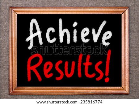 Achieve results! handwritten on a chalkboard. Business or Education Concept