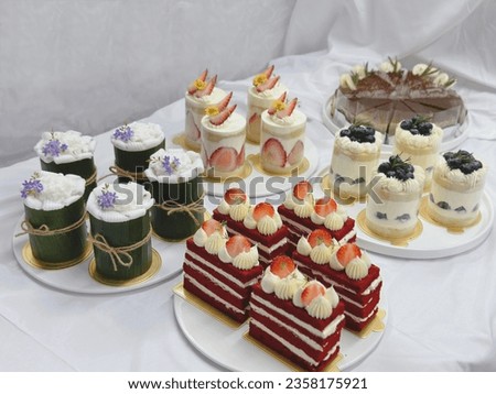 Home made cake on white background. Strawberry cream cheese cake. 
cheesecake on a wooden plate. Fresh  Strawberry topping with cream and thyme leaves. Bakery picture free space for text.