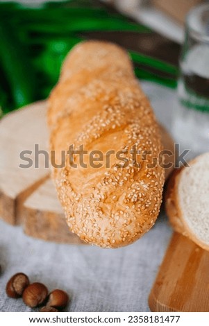 The concept of healthy eating, diet. Sesame bread on the table.