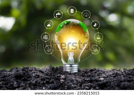A light bulb with a green world map symbolizes renewable and sustainable energy sources for environmental protection. Royalty-Free Stock Photo #2358215015
