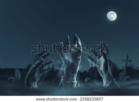 Creepy zombies rising from their graves in the cemetery, horror and Halloween concept Royalty-Free Stock Photo #2358235857