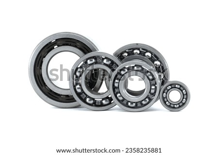 Group of various ball bearings isolated on white background. Spare parts for roller machine in heavy machinery and automotive industry Royalty-Free Stock Photo #2358235881