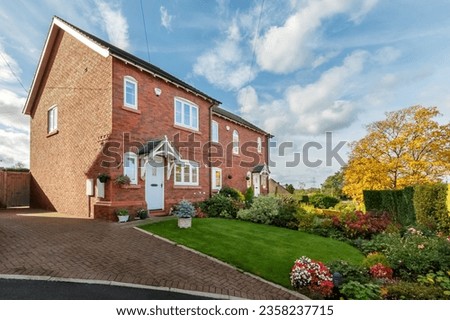 impressive detached house in the English countryside Royalty-Free Stock Photo #2358237715