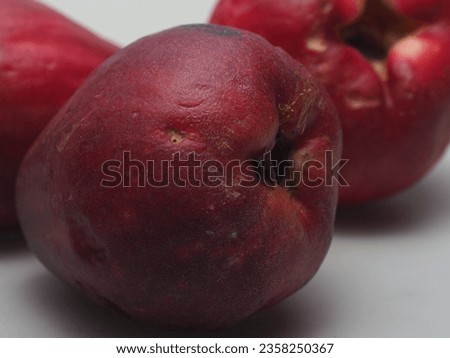 bekasi, west java, indonesia, july 20th 2022 : jambu bol known as malay apple or Syzygium malaccense fresh already riped and ready to eat, shot with white background and soft power light