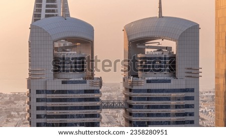 Close up view of the high-rise buildings on Sheikh Zayed Road in Dubai aerial timelapse, UAE. Skyscrapers top in International Financial Centre financial hub from above during sunset Royalty-Free Stock Photo #2358280951