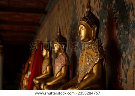 Statue of Buddha sitting meditation in the temple. Religious background. Royalty-Free Stock Photo #2358284767