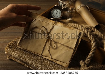 Columbus Day. A pocket watch with a stack of old letters