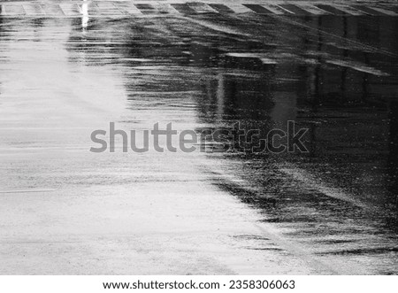 wet asphalt road texture after rain, water reflection in street Royalty-Free Stock Photo #2358306063