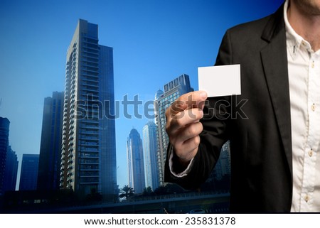 Businessman holding business card in hand 