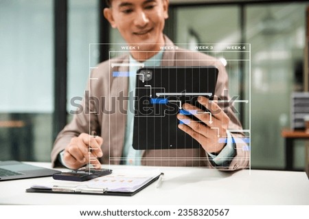 Project manager working and update tasks with milestones progress planning and Gantt chart scheduling diagram. business working with smart phone, tablet and laptop in office.
