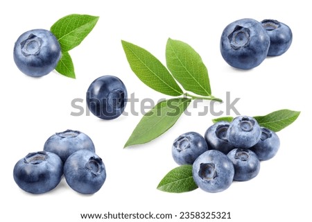 Set with fresh ripe blueberries and green leaves isolated in white Royalty-Free Stock Photo #2358325321